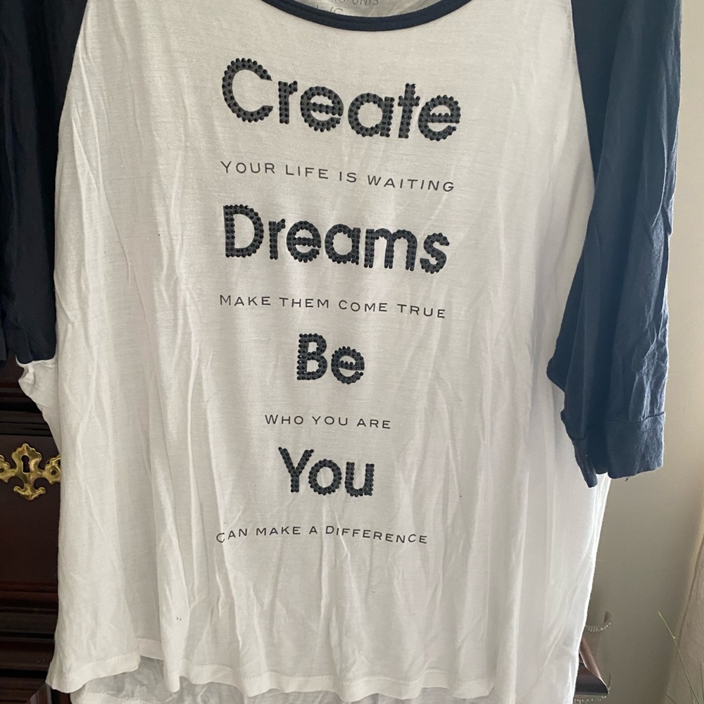 Blue and white top with baseball sleeves/ inspiration wording.